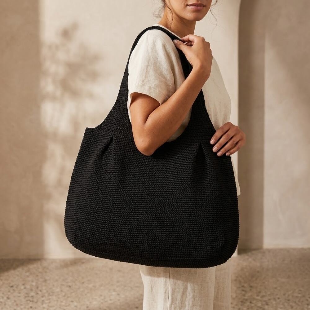 The Sak black crochet shoulder bag woven waffle knit fun interior outer zipper